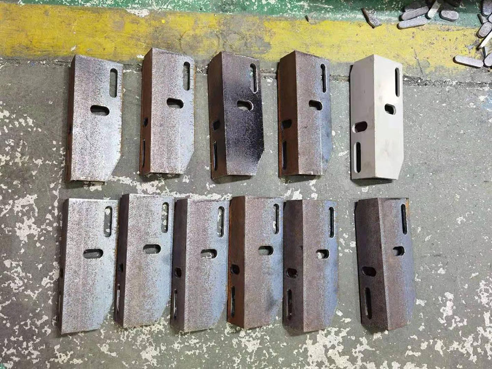 punched and cut angle steel components for electrical transmission towers