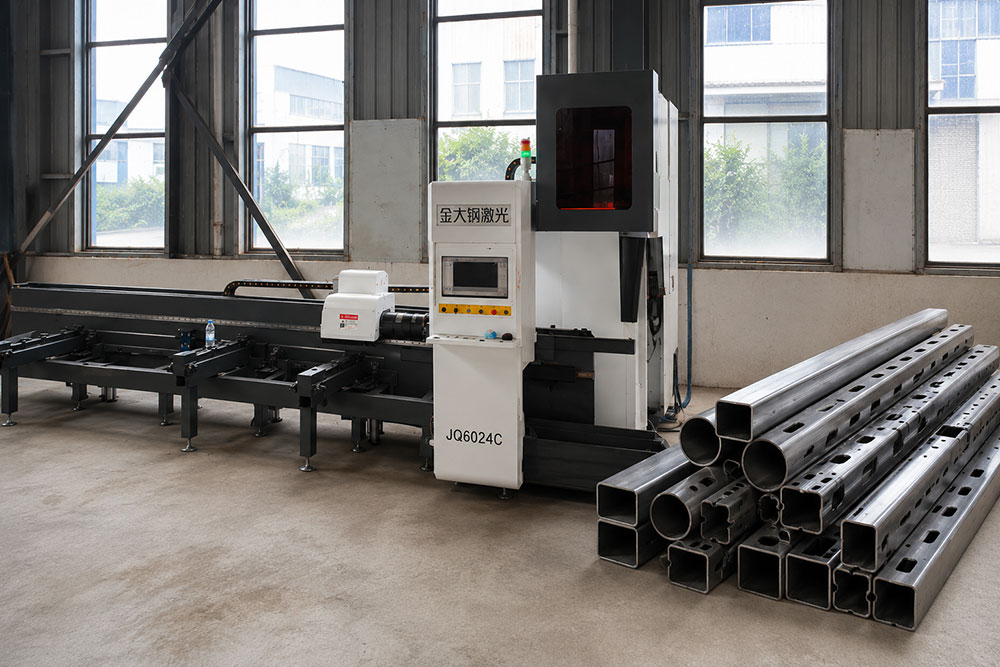 Laser tube cutting machine processing steel tubes in a modern metal fabrication workshop
