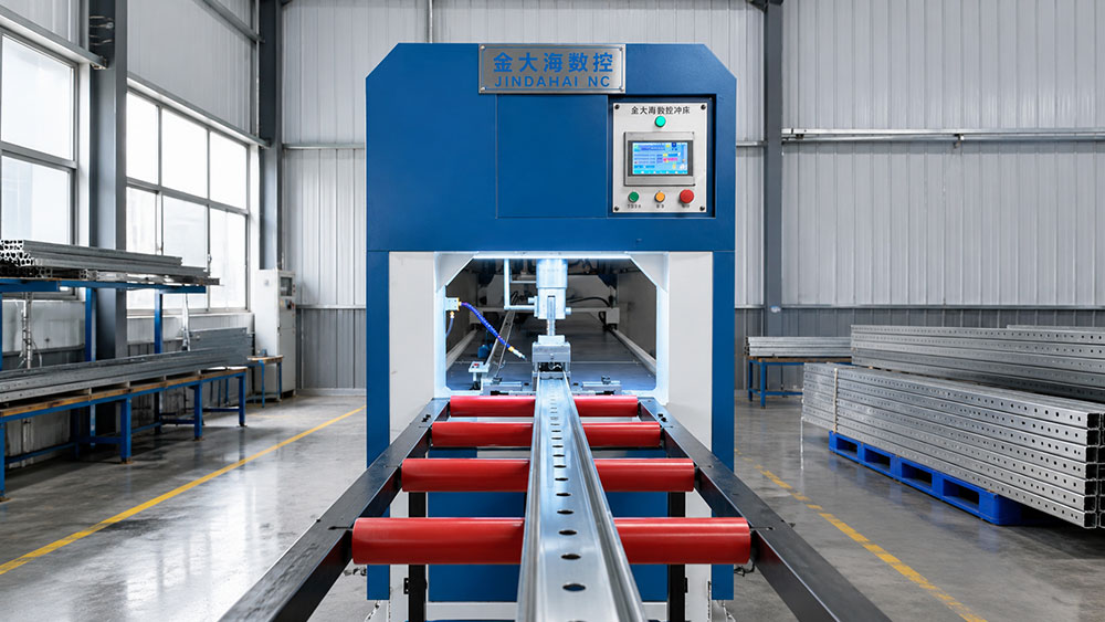 CNC punching machine processing metal profiles in an industrial workshop, helping manufacturers improve hole accuracy, production efficiency, and metal fabrication quality.